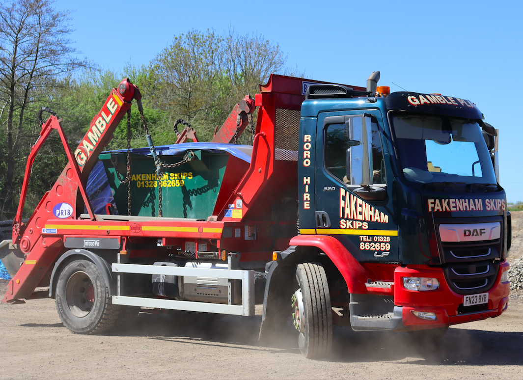 live action picture of fakenham skips lorry holding skip